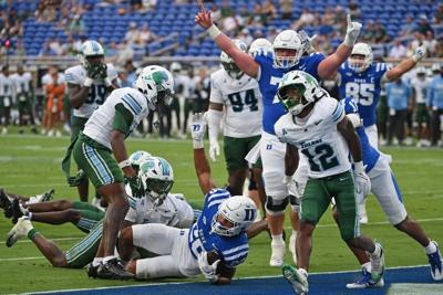Sep 5, 2026; Durham, North Carolina, USA;  Duke Blue Devils running back Nate Sheppard (20) scores the first touchdown of the game during the first quarter against the Tulane Green Wave at Wallace Wade Stadium.  Mandatory Credit: Zachary Taft-Imagn Images