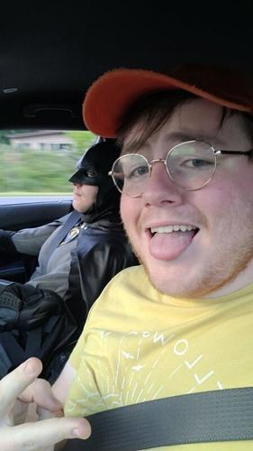 Liam Henson, pictured in summer 2025 with his friend Samuel Daniels, the Burnsville Batman. Henson said that he asked to shadow Daniels as he patrolled the streets of Burnsville.