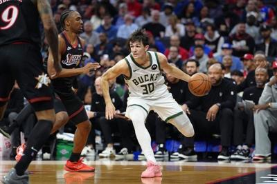 Apr 12, 2026; Philadelphia, Pennsylvania, USA; Milwaukee Bucks guard Cormac Ryan (30) drives against Philadelphia 76ers guard Tyrese Maxey (0) in the second quarter at Xfinity Mobile Arena. Mandatory Credit: Kyle Ross-Imagn Images