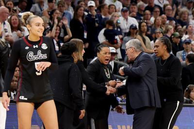 South Carolina head coach Dawn Staley and UConn head coach Geno Auriemma exchange words late in the fourth quarter in the Final Four of the NCAA Tournament at Mortgage Matchup Center on Friday, April 3, 2026, in Phoenix.
