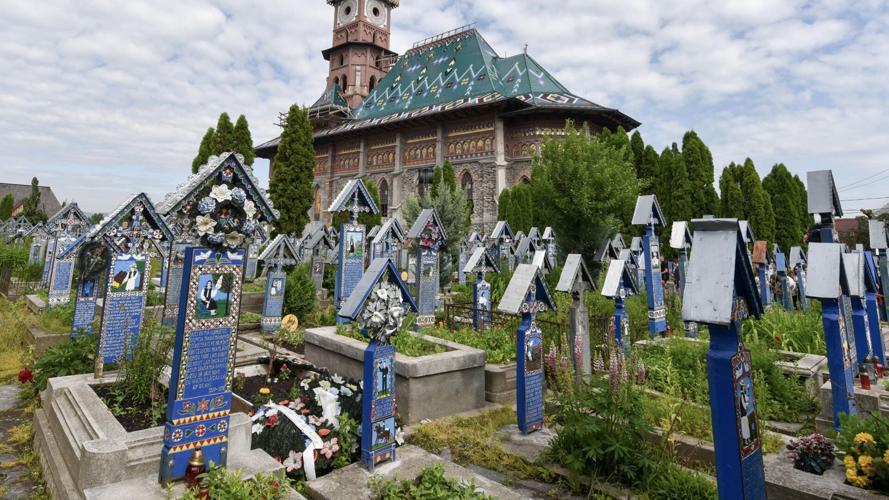 At the " Merry Cemetery" in Maramureș, Romania, each grave is blue and comes with a whimsical poem and a painting of the departed doing something they loved.