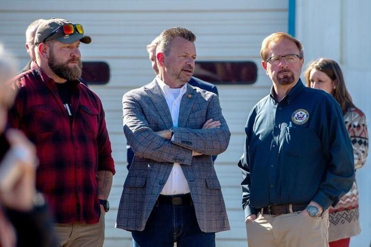 From left, Adam Smith, creator of Savage Freedom Relief Operations, N.C. Rep. Tim Moffitt, and U.S. Rep. Chuck Edwards wait for former President Donald Trump’s appearance in Swannanoa, Oct. 21, 2024.