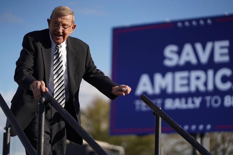Lou Holtz leaves the stage during a rally with former U.S. President Donald Trump at the Florence Regional Airport on March 12, 2022, in Florence, South Carolina.