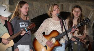 McDowell school's string band started small. Now, the band is making an album, plays concerts