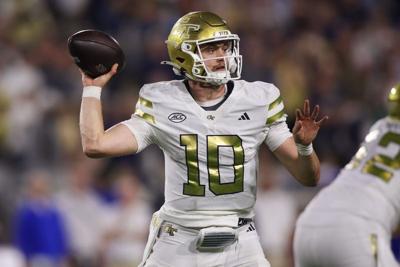 Nov 22, 2025; Atlanta, Georgia, USA; Georgia Tech Yellow Jackets quarterback Haynes King (10) throws a pass against the Pittsburgh Panthers in the third quarter at Bobby Dodd Stadium at Hyundai Field. Mandatory Credit: Brett Davis-Imagn Images