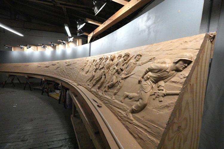 Emily Bedard, art director and lead scupltor for Foster Reeve, and artist behind the Desert Shield and Desert Storm Memorial, with her original clay creation of the memorial in her studio at the Garnerville Arts Center April 2, 2026.