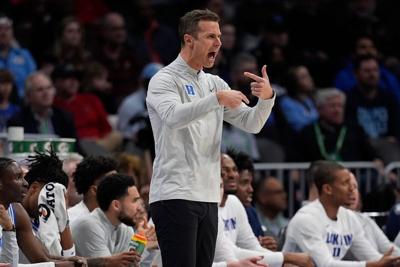Mar 12, 2026; Charlotte, NC, USA; Duke Blue Devils head coach Jon Scheyer reacts to play during the first half against the Florida State Seminoles at Spectrum Center. Mandatory Credit: Jim Dedmon-Imagn Images