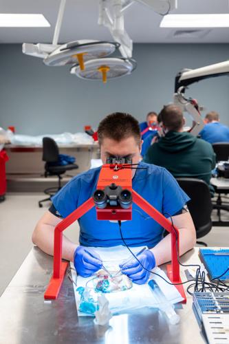 Ukrainian surgeon Maks Makarenkov learns microsurgery techniques at the UW Microsurgery Regenerative Medicine Lab in Madison in April. The plastic surgery division hosted six Ukrainian frontline trauma surgeons for a two-week intensive training.
