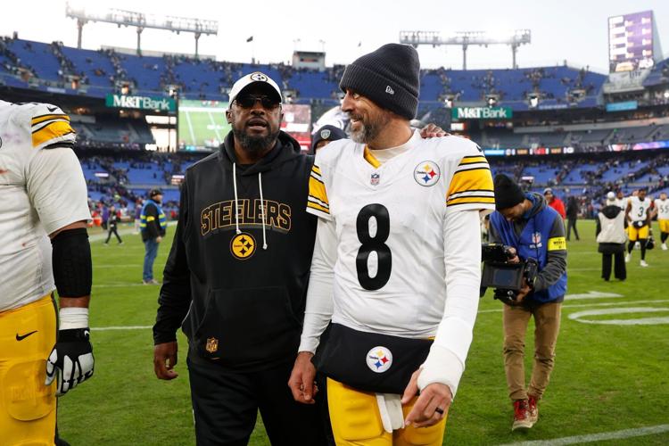 Dec 7, 2025; Baltimore, Maryland, USA; Pittsburgh Steelers head coach Mike Tomlin and quarterback Aaron Rodgers (8) walk off the field after the game against the Baltimore Ravens at M&T Bank Stadium. Mandatory Credit: Peter Casey-Imagn Images