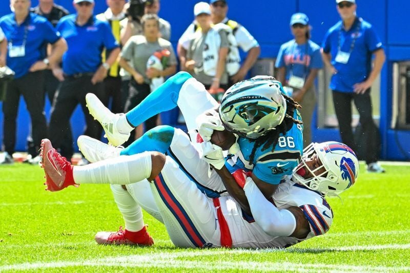 Aug 15, 2026; Orchard Park, New York, USA; Carolina Panthers wide receiver Ja'seem Reed (86) scores a touchdown on the tackle by Buffalo Bills defensive back Geno Stone (25) in the second quarter at the New Highmark Stadium. Mandatory Credit: Mark Konez...