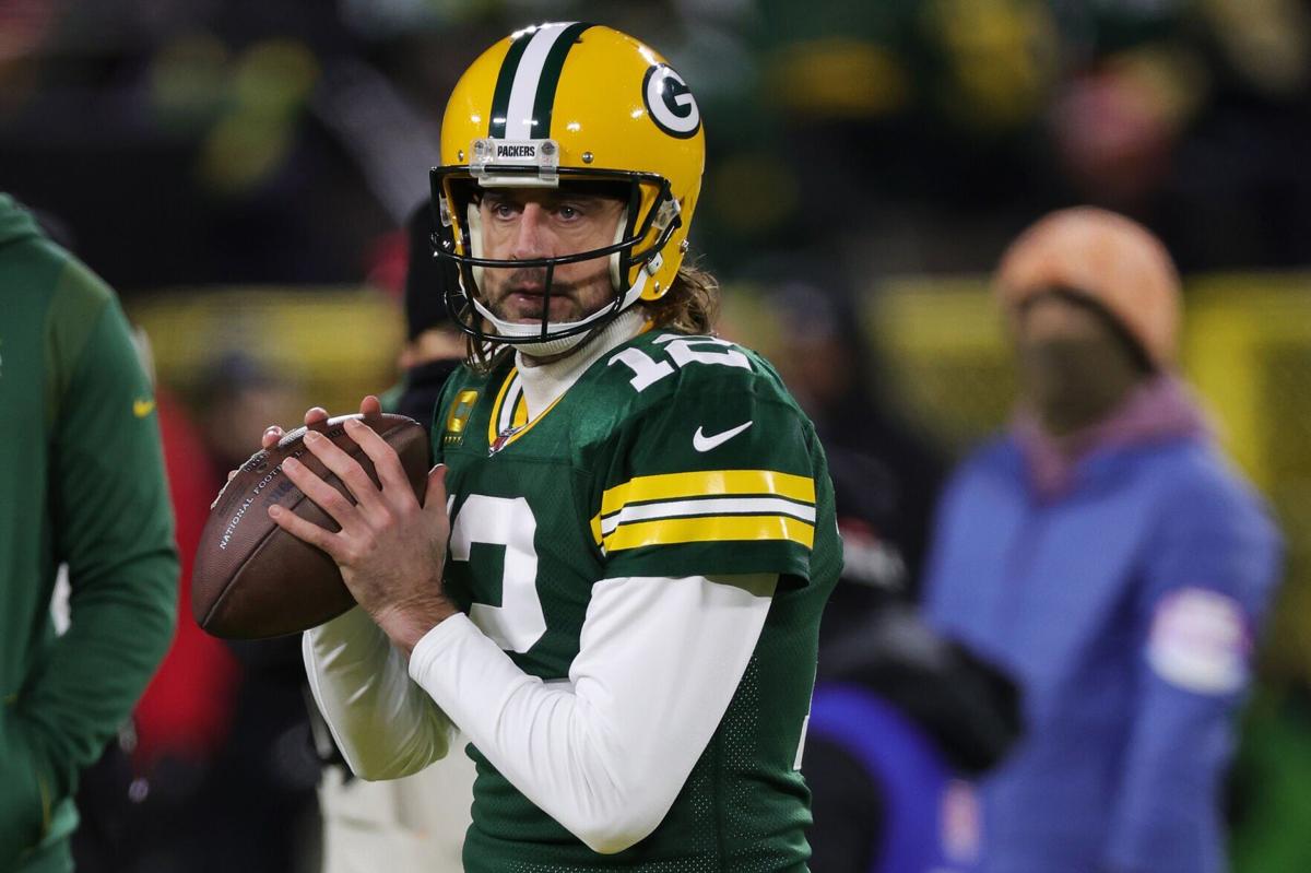 Aaron Rodgers of the Green Bay Packers warms up before playing the San Francisco 49 ers in the NFC Divisional Playoff game at Lambeau Field on Jan. 22, 2022, in Green Bay, Wisconsin.