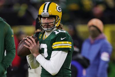 Aaron Rodgers of the Green Bay Packers warms up before playing the San Francisco 49 ers in the NFC Divisional Playoff game at Lambeau Field on Jan. 22, 2022, in Green Bay, Wisconsin.