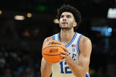Mar 19, 2026; Greenville, SC, USA; Duke Blue Devils forward Cameron Boozer (12) shoots a free throw against the Siena Saints in the first half during a first round game of the men's 2026 NCAA Tournament at Bon Secours Wellness Arena. Mandatory Credit: B...