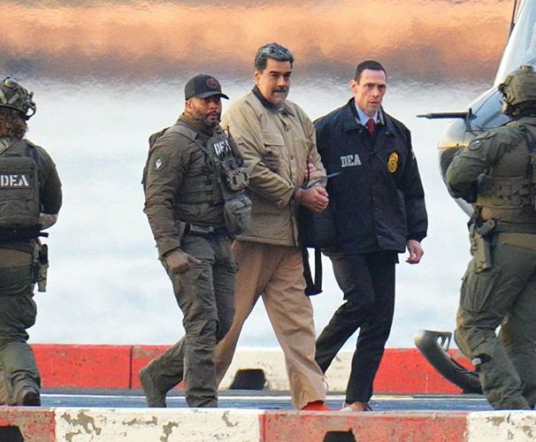 Nicolas Maduro in handcuffs after landing at a Manhattan helipad, escorted by heavily armed Federal agents as he and his wife make their way into an armored car en route to a Federal courthouse in Manhattan on Jan. 5, 2026, in New York City.