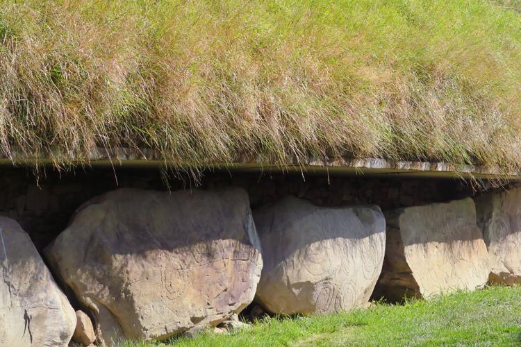 Patterns are carved into the sandstone at the burial mound which are part of the Brú na Bóinne sacred sites in Ireland.