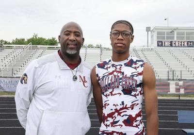 Mallard Creek track coach Samuel Willoughby with standout Nyan Brown, who will run track in college at N.C. State. Brown was disqualified after a mild celebration in the 4x400 relay in the state championship meet Saturday in Greensboro.