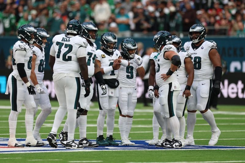 Oct 11, 2026; Tottenham, ENG;  Philadelphia Eagles quarterback Jalen Hurts (1) huddles with hsi offense during the second half against the Jacksonville Jaguars at Tottenham Hotspur Stadium.  Mandatory Credit: Nathan Ray Seebeck-Imagn Images