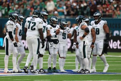 Oct 11, 2026; Tottenham, ENG;  Philadelphia Eagles quarterback Jalen Hurts (1) huddles with hsi offense during the second half against the Jacksonville Jaguars at Tottenham Hotspur Stadium.  Mandatory Credit: Nathan Ray Seebeck-Imagn Images