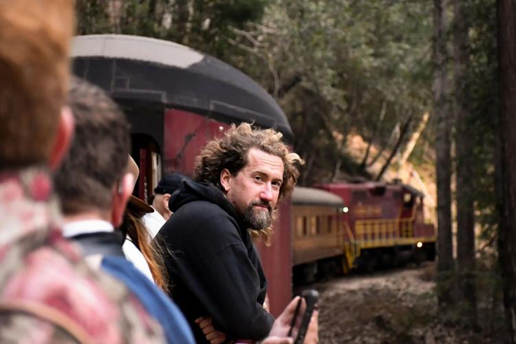 A passenger soaks up atmosphere on the two-hour, round-trip Skunk Train journey from Willits in Mendocino County.