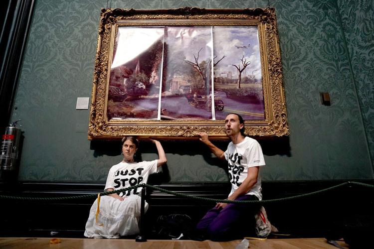 Climate protesters glue themselves to 200-year-old masterpiece