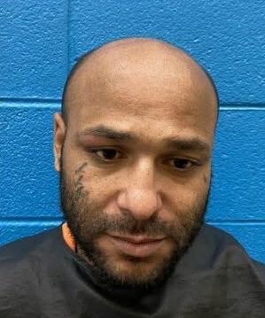 Forest City man charged with shooting into occupied vehicle