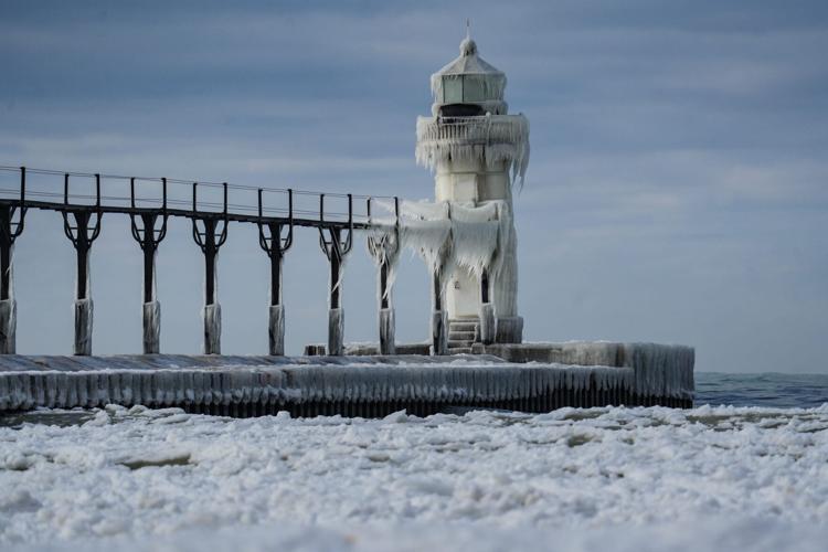 Ice formations seen on the North Pier Outer Light lighthouse in St. Joseph, Mich., Sunday, Jan. 4, 2026. [Matthew Dae Smith/USA Today Network]