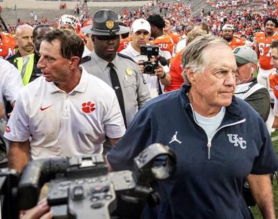 Clemson head coach Dabo Swinney and University of North Carolina Head Coach Bill Belichick briefly shake hands after the game in Memorial Stadium in Clemson, S.C. Saturday, September 19, 2026. Clemson won 28-20.