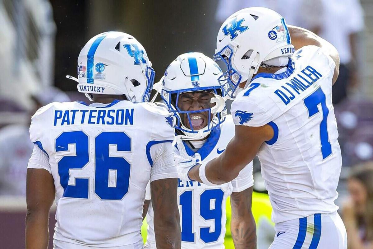 Kentucky wide receiver Kenny Darby celebrates with running back Jason Patterson and wide receiver DJ Miller after scoring a touchdown against Texas A&M at Kyle Field on Sept. 19, 2026, in College Station, Texas.
