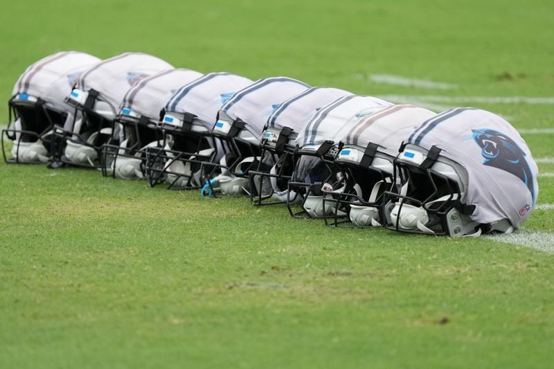 Aug 4, 2026; Charlotte, NC, USA;  Carolina Panthers helmets covered in protectors during training camp at Bank of America Stadium. Mandatory Credit: Jim Dedmon-Imagn Images