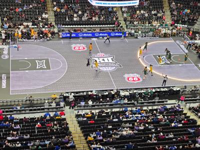 The 3-point line of the ASB GlassFloor LED court lights up during the Arizona State-Baylor game of the 2026 Big 12 men's basketball tournament, Tuesday, March 10, 2026, in T-Mobile Center at Kansas City. The Big 12 introduced the LED court to the conferenc