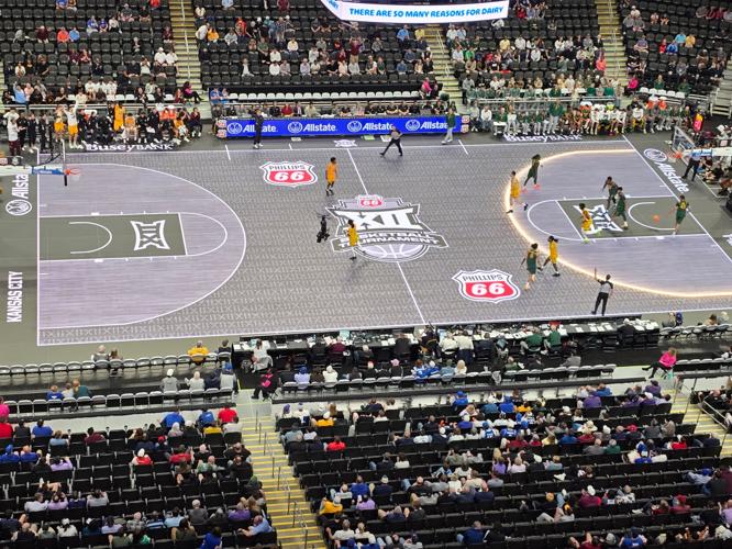 The 3-point line of the ASB GlassFloor LED court lights up during the Arizona State-Baylor game of the 2026 Big 12 men's basketball tournament, Tuesday, March 10, 2026, in T-Mobile Center at Kansas City. The Big 12 introduced the LED court to the conferenc