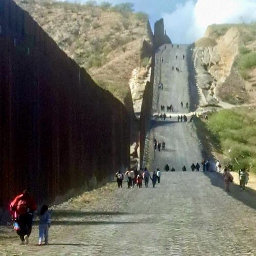 Asylum seekers walking toward Sasabe, Ariz.