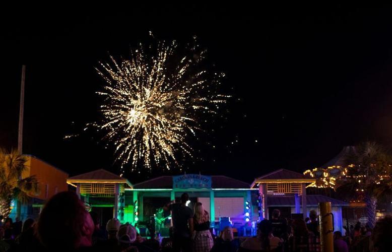 People watch fireworks near the Carolina Beach Boardwalk Gazebo in 2019 as part of Boardwalk Blast.
