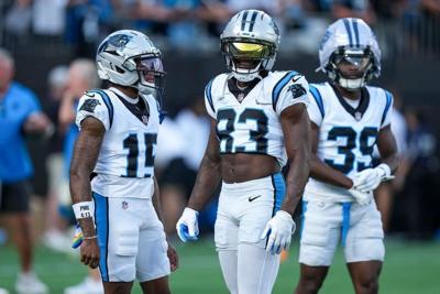 Jul 31, 2026; Charlotte, NC, USA; Carolina Panthers wide receiver Jimmy Horn Jr. (15) and wide receiver David Moore (83) chat during Fanfest at Bank of America Stadium. Mandatory Credit: Jim Dedmon-Imagn Images
