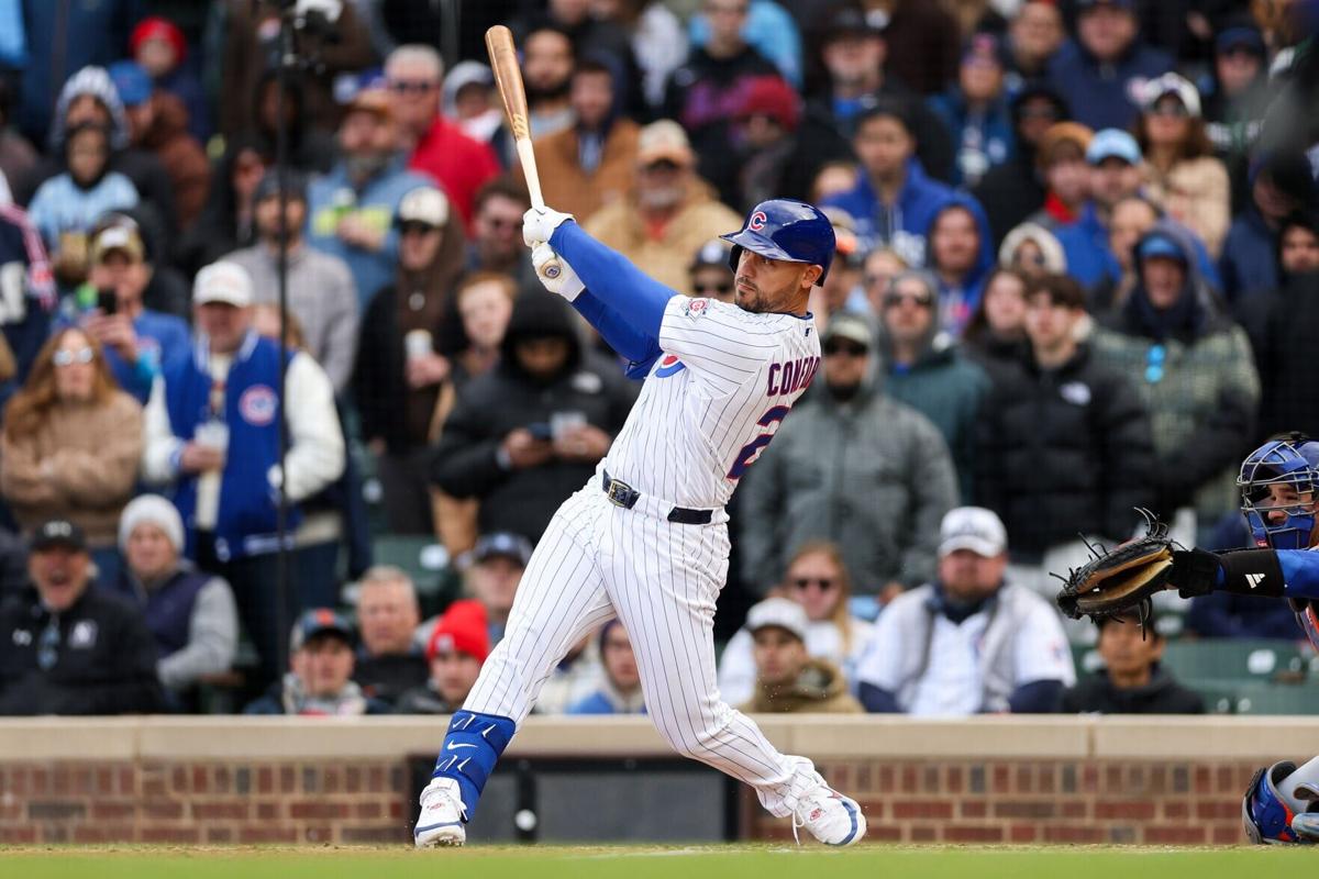 The Chicago Cubs' Michael Conforto hits an RBI double during the ninth inning against the New York Mets at Wrigley Field on April 19, 2026, in Chicago.