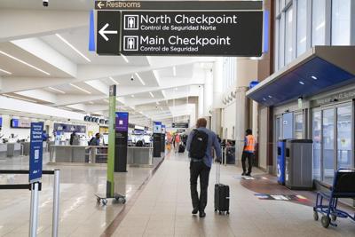 Travelers move through the airport while lines remain at a minimum at Atlanta Hartsfield-Jackson International Airport on March 28, 2026, in Atlanta.
