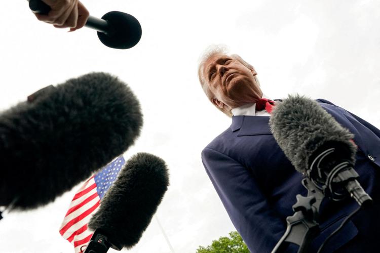FILE PHOTO: U.S. President Donald Trump talks to reporters at the White House in Washington
