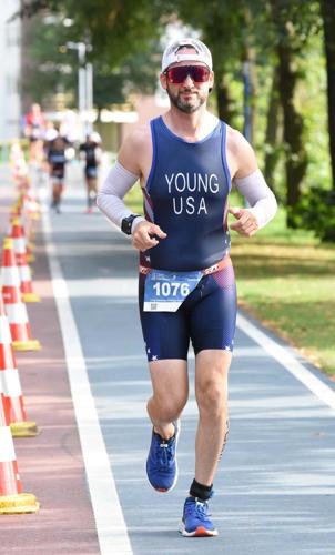 The long run: Former Titan wrestler competes in world triathlon championships - with some help from his old coach