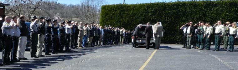 Colleagues, friends, governor honor late Officer Jason Crisp