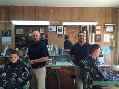A family tradition: Two members of the Harris family are again cutting hair at City Barber Shop