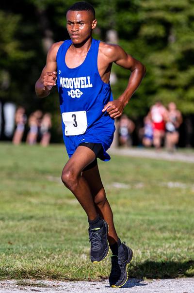 Titans' Carson tops at Farm Invitational meet