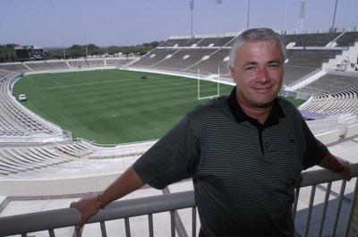 TCU head coach Dennis Franchione leans on the railing outside his office that overlooks the playing field at Amon G. Carter Stadium on Sept. 5, 2000, in Fort Worth, Texas.