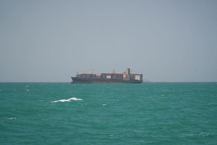 FILE PHOTO: A cargo ship sails in Saudi waters near the Dammam Port in Dammam