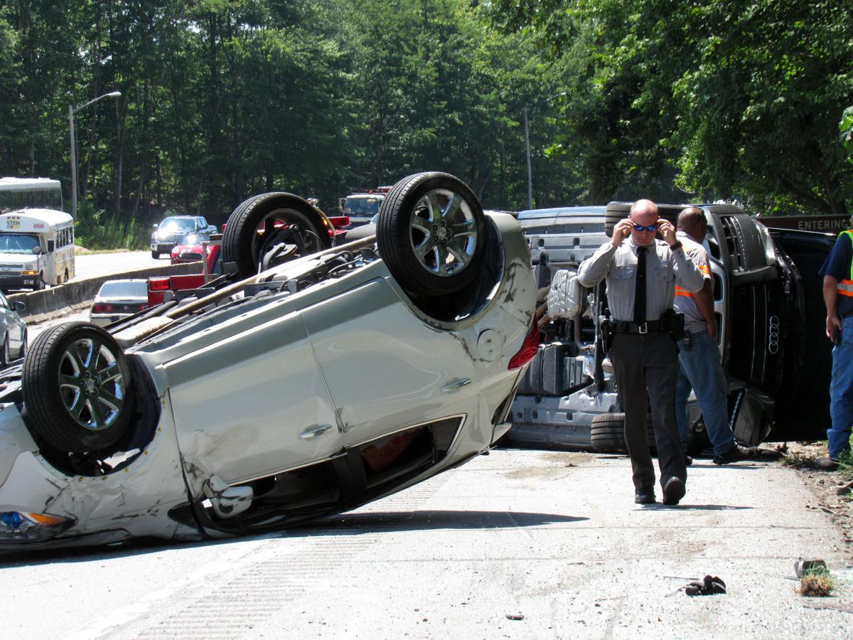 Cars tumble off hauler on I-40