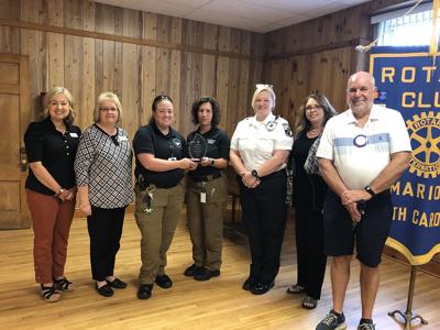 Winners of Battle of the Badges honored at Rotary Club meeting