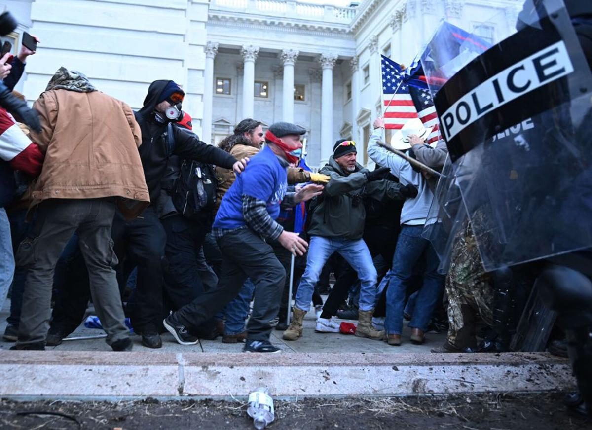 Trump supporters clash with police and security forces, as they storm the US Capitol in Washington, DC, on January 6, 2021.