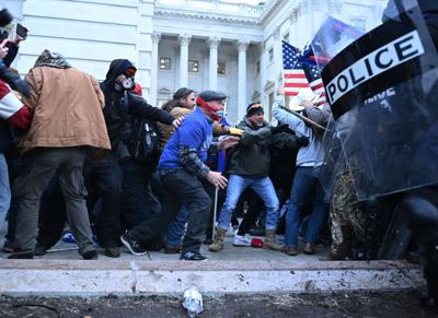 Trump supporters clash with police and security forces, as they storm the US Capitol in Washington, DC, on January 6, 2021.