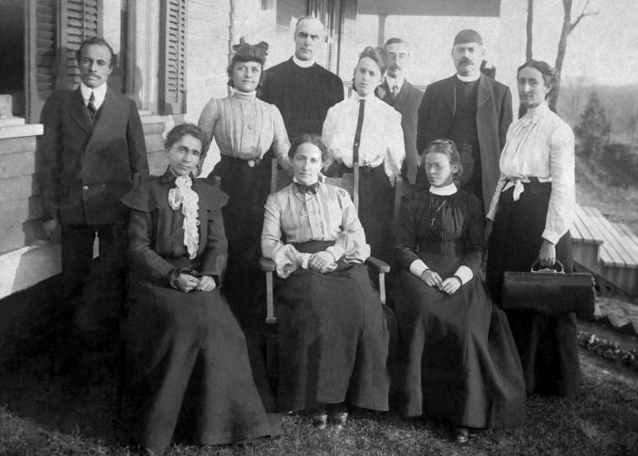 Mary Hughson w church people.jpg