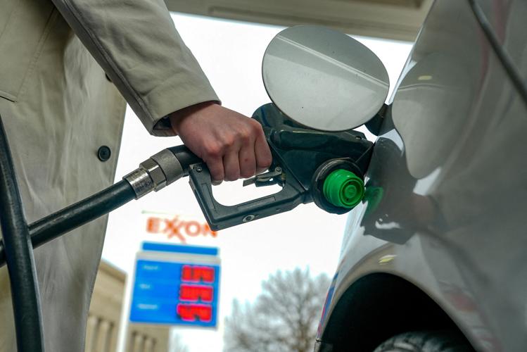 FILE PHOTO: Gas prices are seen at a fuelling station as the price of oil and gas has surged amid the U.S.-Israeli conflict with Iran, in Washington