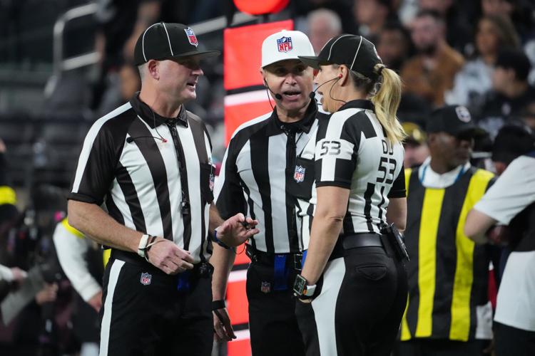 NFL officials talk between plays during the second half of a game between the Las Vegas Raiders and the Dallas Cowboys on Nov. 17, 2025, at Allegiant Stadium in Paradise, Nevada.
